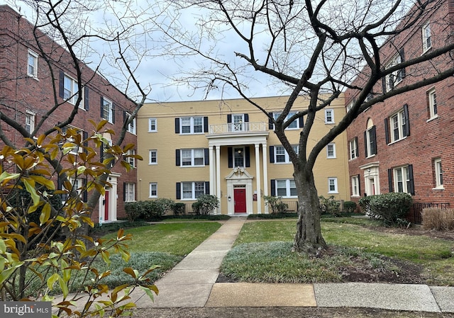 view of property with a front lawn