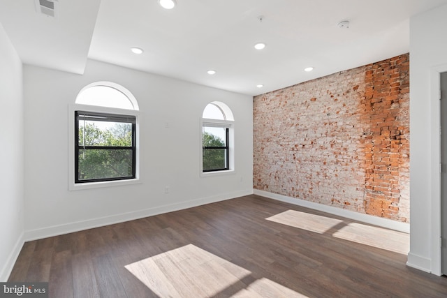 empty room with dark wood-type flooring