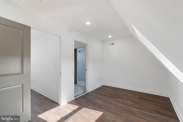 bonus room featuring dark hardwood / wood-style floors