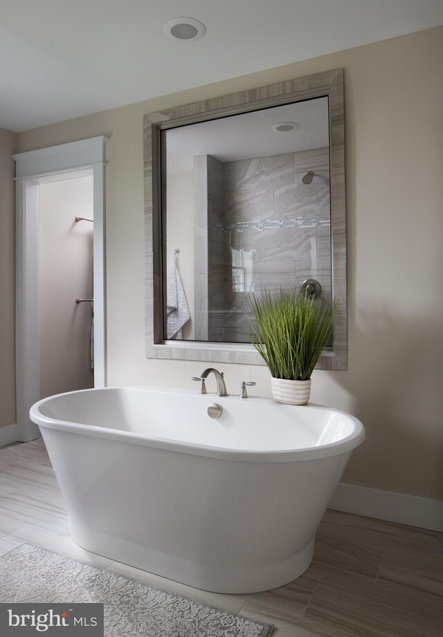 bathroom featuring a tub to relax in