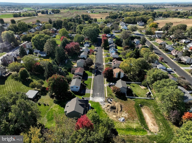 birds eye view of property with a residential view