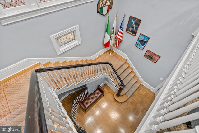 staircase with a towering ceiling