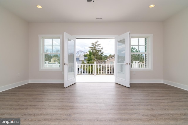 spare room featuring hardwood / wood-style floors