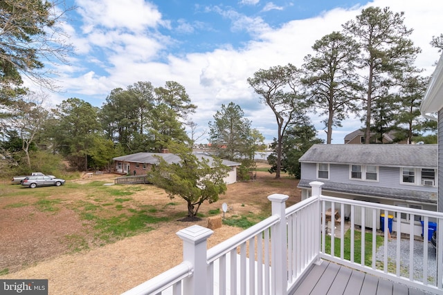 deck featuring a lawn