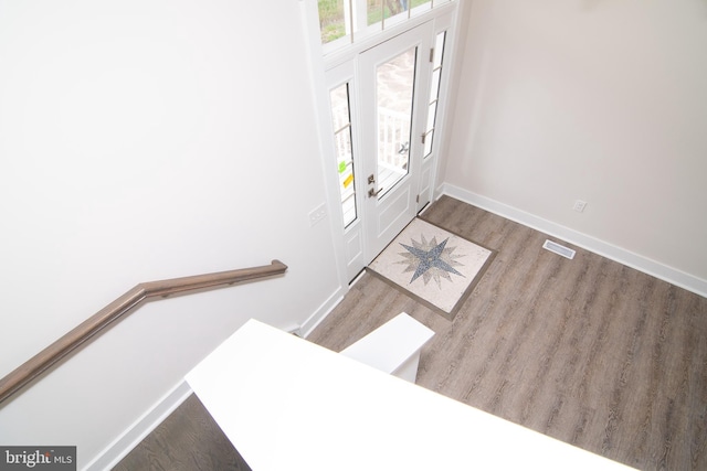 foyer entrance with hardwood / wood-style flooring