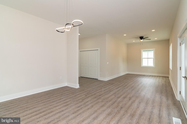 spare room with light hardwood / wood-style flooring and ceiling fan