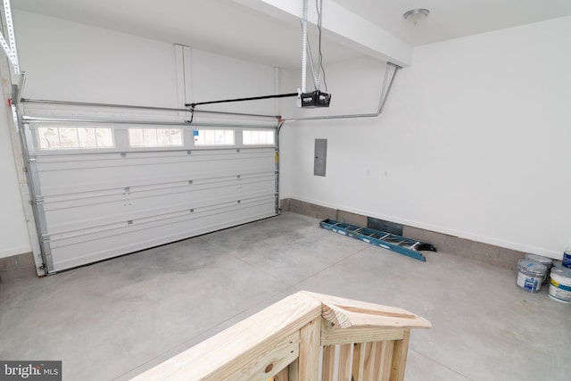 garage featuring a garage door opener and electric panel