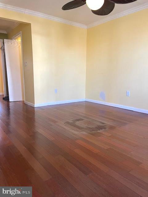 unfurnished room with dark hardwood / wood-style floors, ceiling fan, and ornamental molding