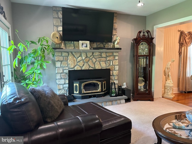 carpeted living room featuring a fireplace