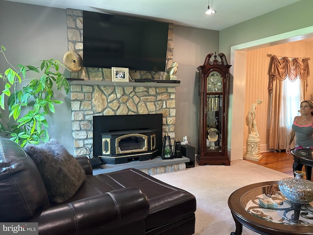 carpeted living room with a fireplace