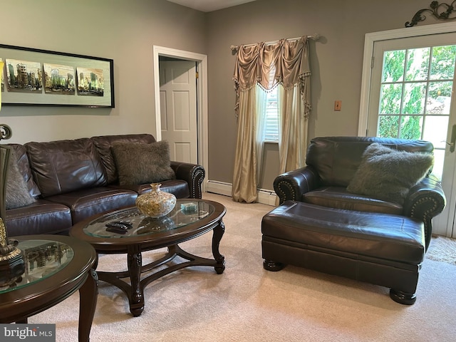 carpeted living room featuring a baseboard radiator