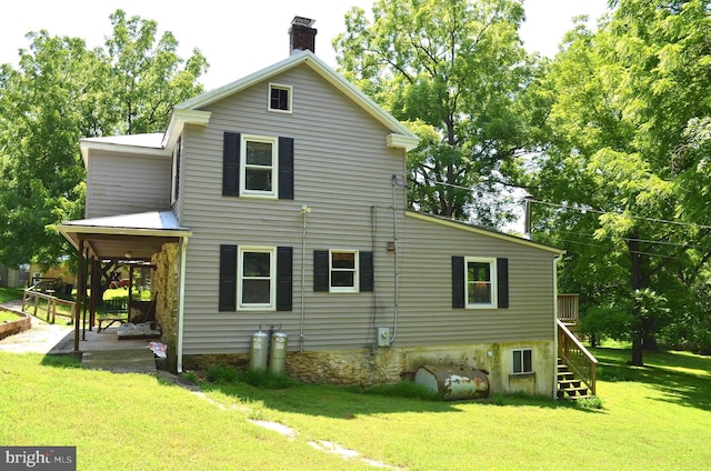 view of home's exterior with a lawn