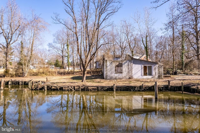 rear view of property featuring a water view