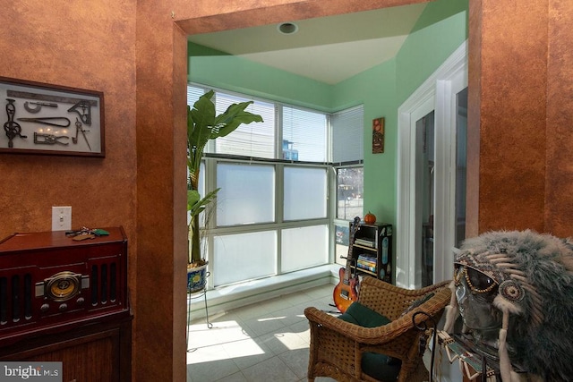 sitting room with tile flooring