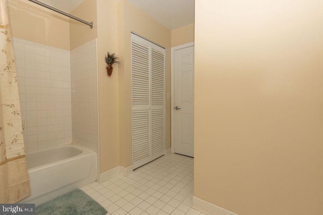 bathroom with shower / tub combo and tile flooring