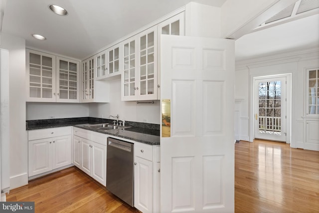 kitchen featuring sink, crown molding, stainless steel dishwasher, light hardwood / wood-style floors, and white cabinetry