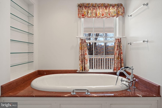 bathroom featuring a bath to relax in