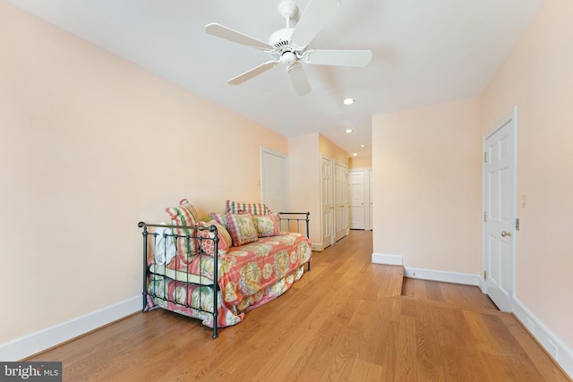 bedroom featuring ceiling fan and light hardwood / wood-style flooring