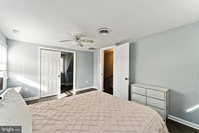 bedroom featuring ceiling fan and dark hardwood / wood-style floors