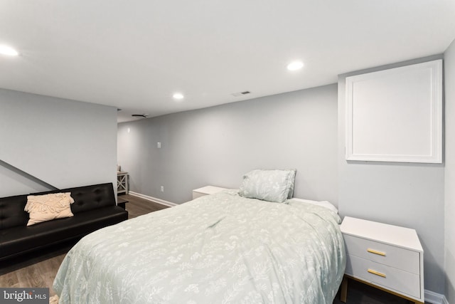 bedroom featuring dark hardwood / wood-style flooring