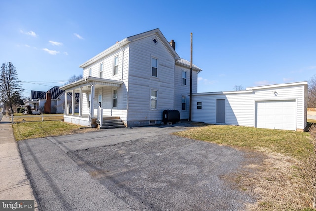 view of home's exterior with a yard and a garage