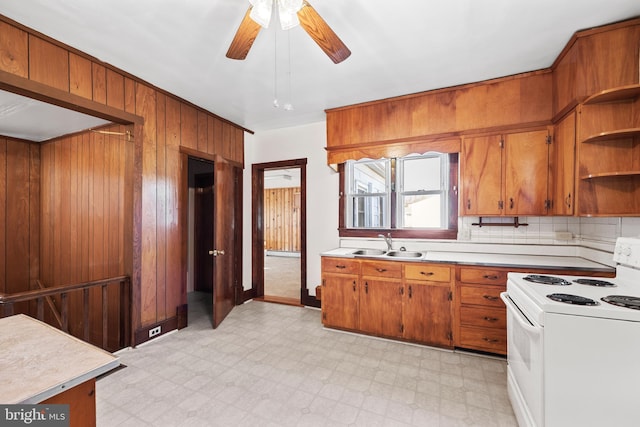 kitchen featuring ceiling fan, sink, light tile floors, white range with electric stovetop, and tasteful backsplash