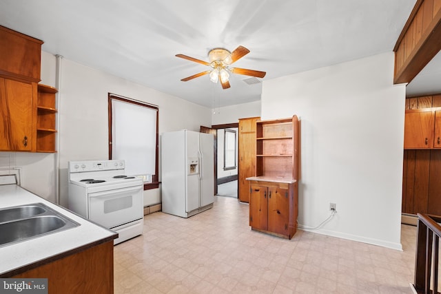 kitchen featuring a baseboard radiator, light tile floors, ceiling fan, white appliances, and sink