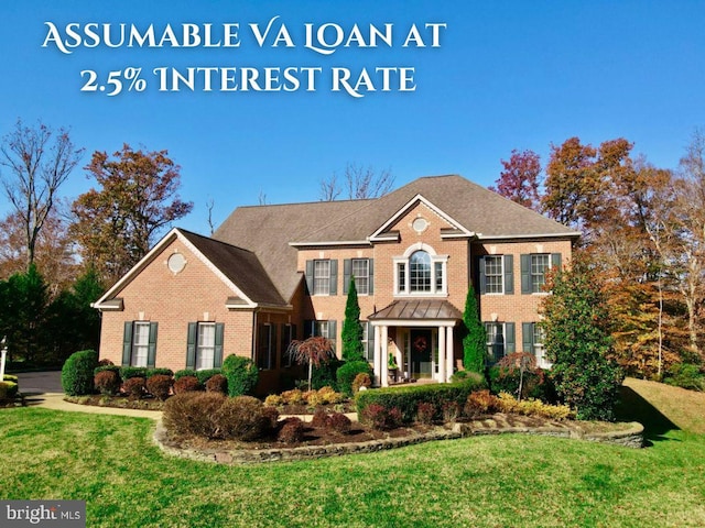 colonial-style house featuring brick siding and a front lawn