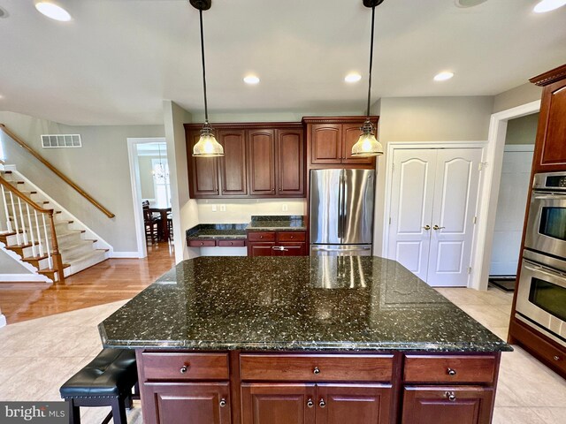 kitchen featuring hanging light fixtures, visible vents, recessed lighting, and appliances with stainless steel finishes