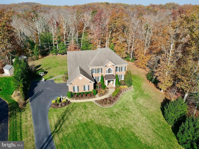 aerial view with a wooded view