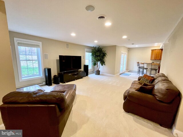 living room featuring light carpet, visible vents, recessed lighting, and baseboards