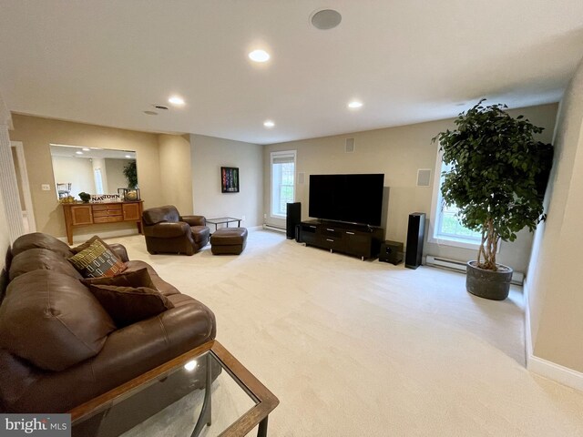 living room with recessed lighting, carpet, baseboards, and a wealth of natural light