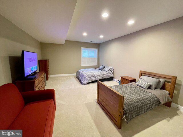 bedroom with recessed lighting, light colored carpet, and baseboards