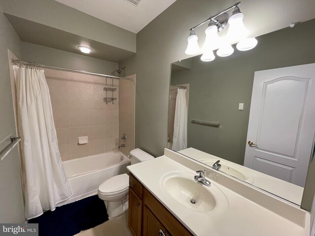 full bathroom featuring vanity, toilet, and shower / tub combo with curtain