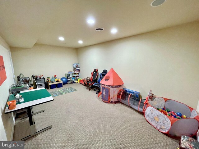 recreation room with visible vents, recessed lighting, and carpet floors