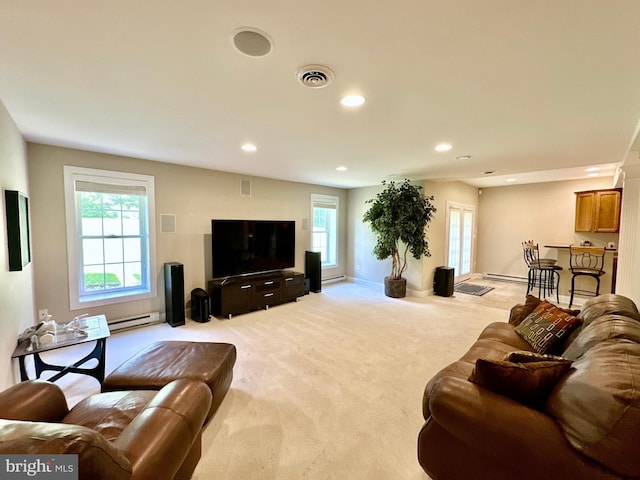 living area featuring baseboards, visible vents, recessed lighting, light carpet, and a baseboard heating unit