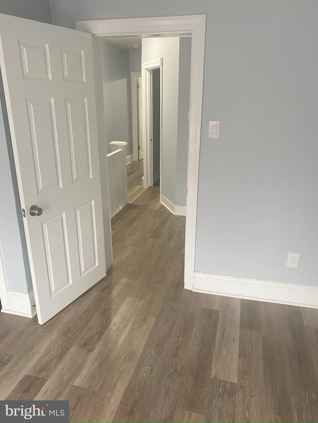 hallway featuring dark hardwood / wood-style floors