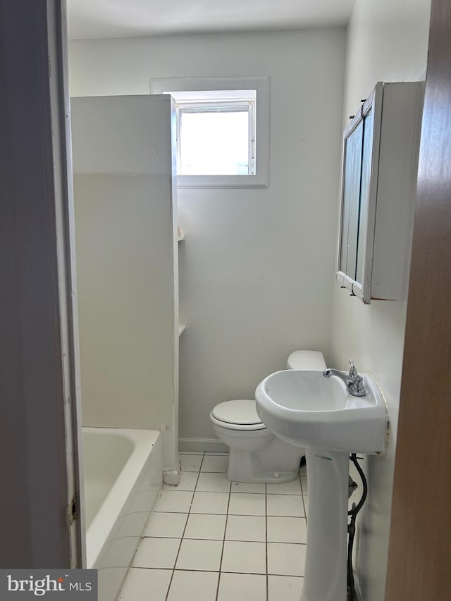 bathroom with tile floors and toilet