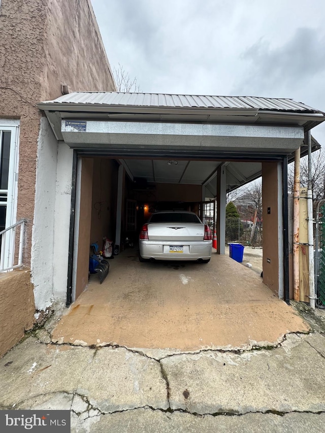 view of vehicle parking with a carport