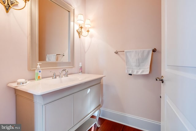 bathroom with vanity and wood-type flooring