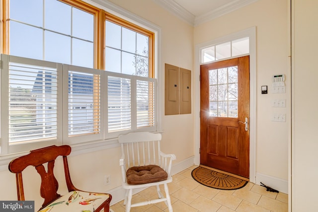 tiled entryway featuring ornamental molding