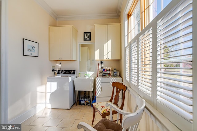 laundry room with cabinets, separate washer and dryer, a healthy amount of sunlight, and light tile patterned floors