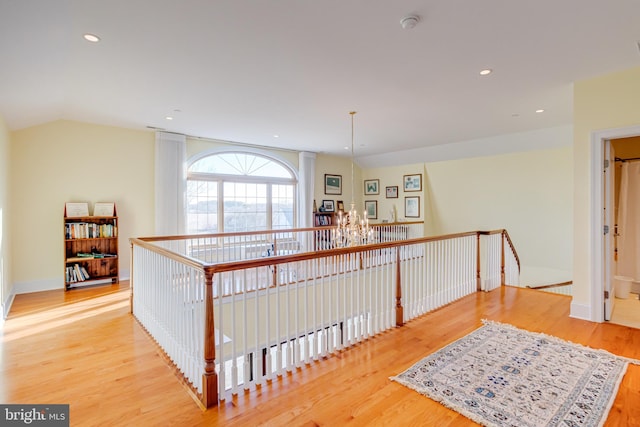 hallway with light hardwood / wood-style floors