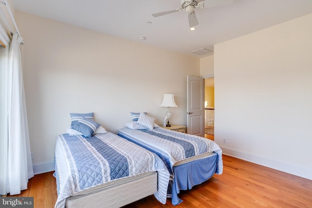 bedroom featuring ceiling fan and hardwood / wood-style floors