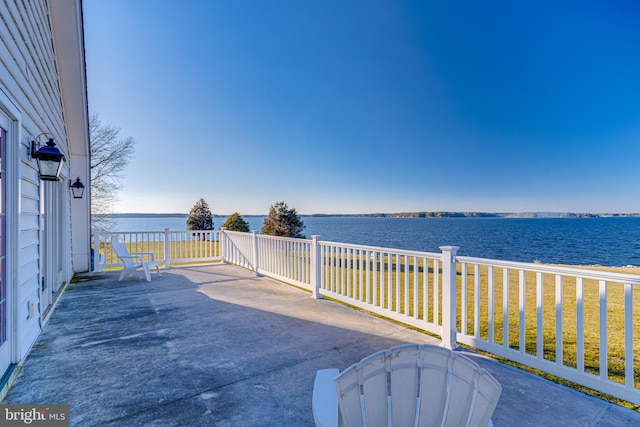 view of patio featuring a water view