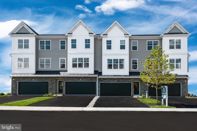 multi unit property featuring a garage