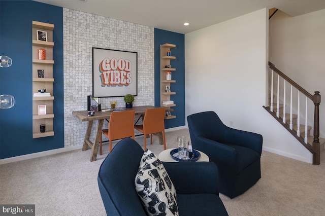 living area featuring light colored carpet and built in shelves