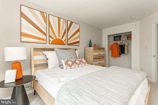 bedroom with light carpet and a closet