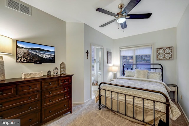 bedroom featuring ensuite bath, ceiling fan, and light carpet