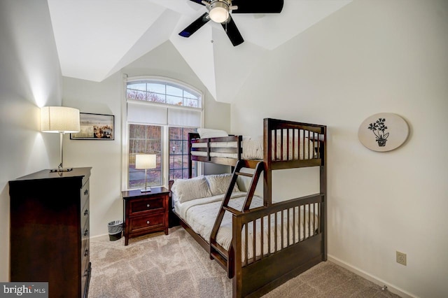 carpeted bedroom with high vaulted ceiling and ceiling fan